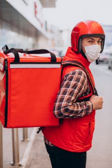 Food delivery man with boxes with food Food delivery man with boxes with food